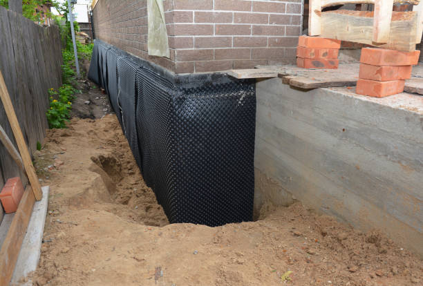 Happy homeowners after waterproofing job in Ocean Gate